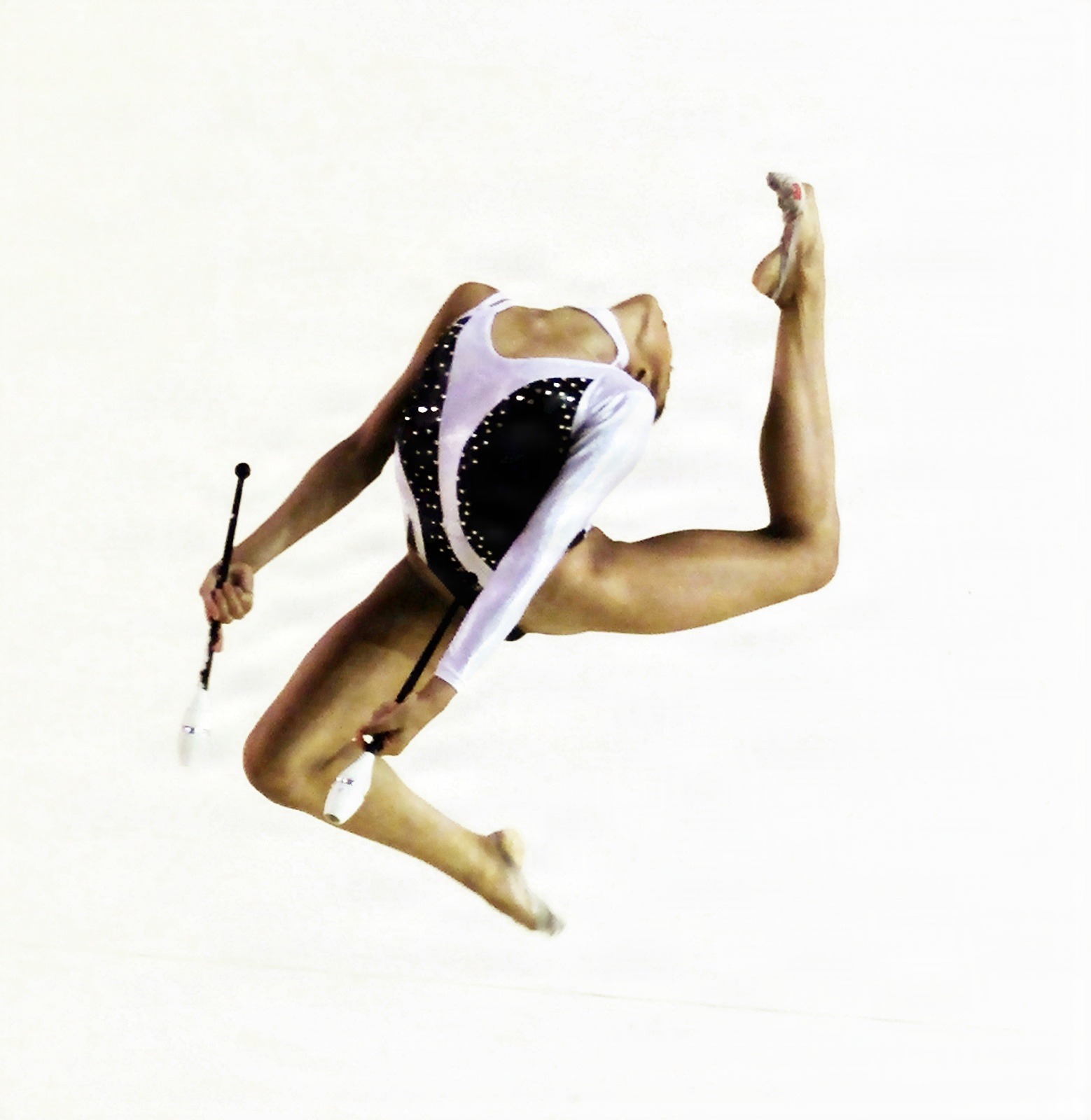 Venezuela`s Catherine Cortez competes with the Clubs at rhythmic gymnastics final event at Central American and Caribbean Games San Salvador, November 26,2002. Cortez won the bronze medal.