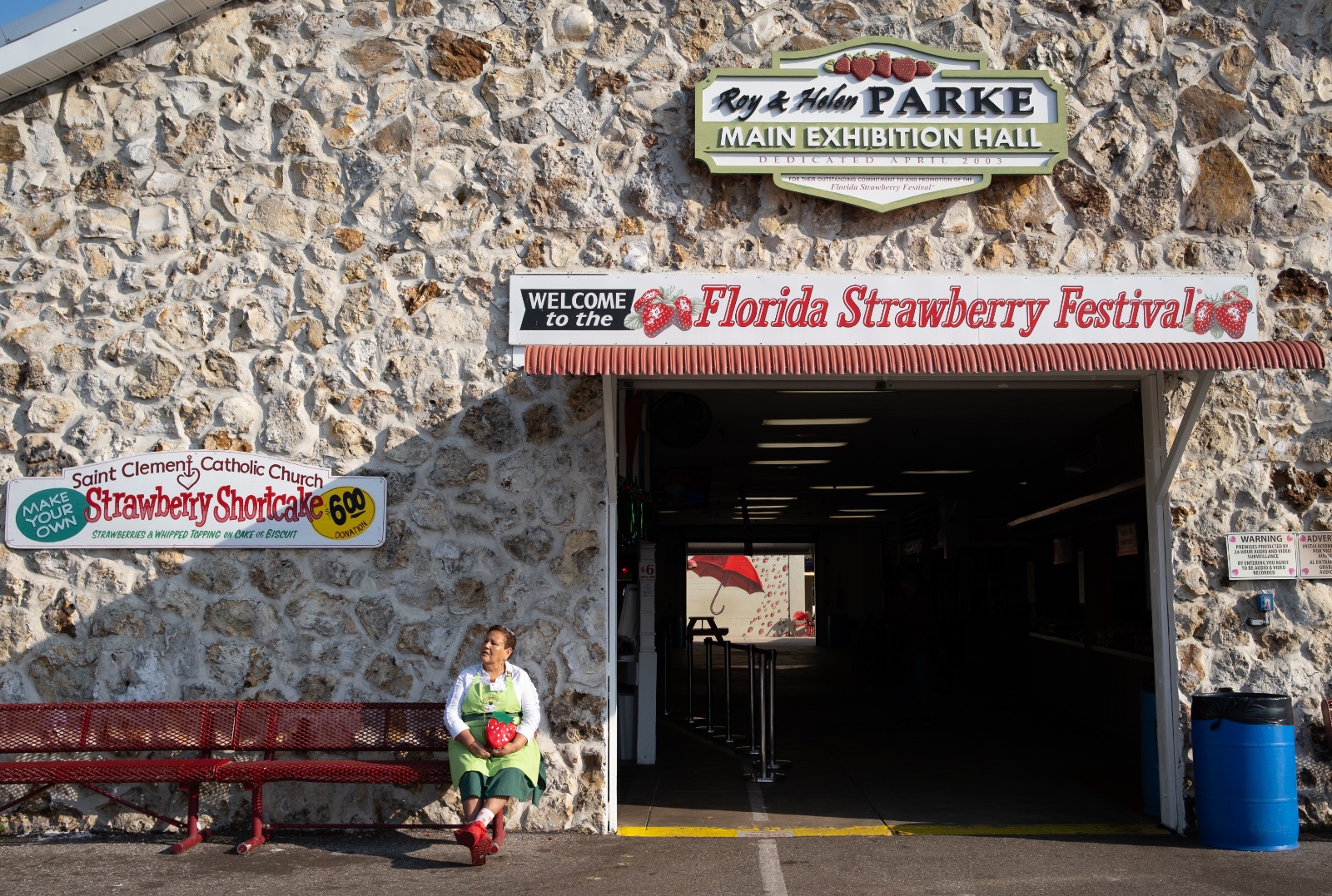 A worker takes a break at the Florida Strawberry Festival in Plant City, Florida March 9, 2025. Photo by Daniel LeClair