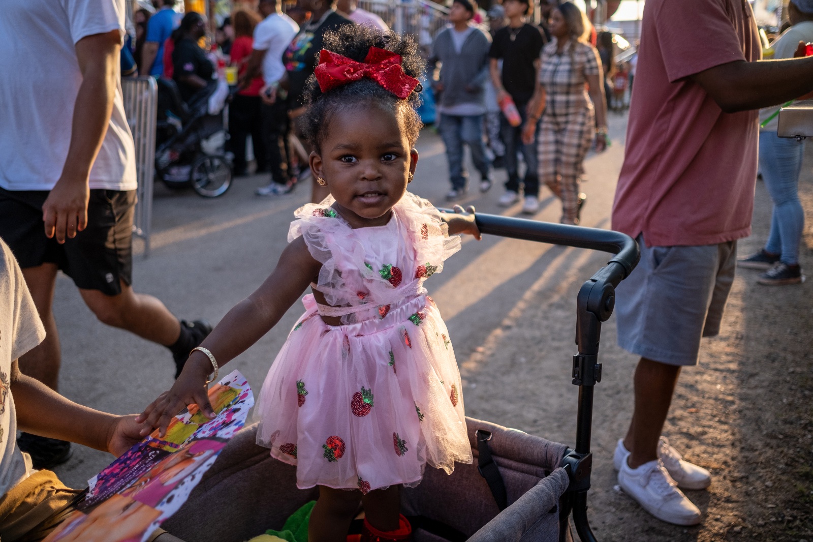 A girl waits for a treat at the Florida Strawberry Festival in Plant City, Florida March 9, 2025. Photo by Daniel LeClair