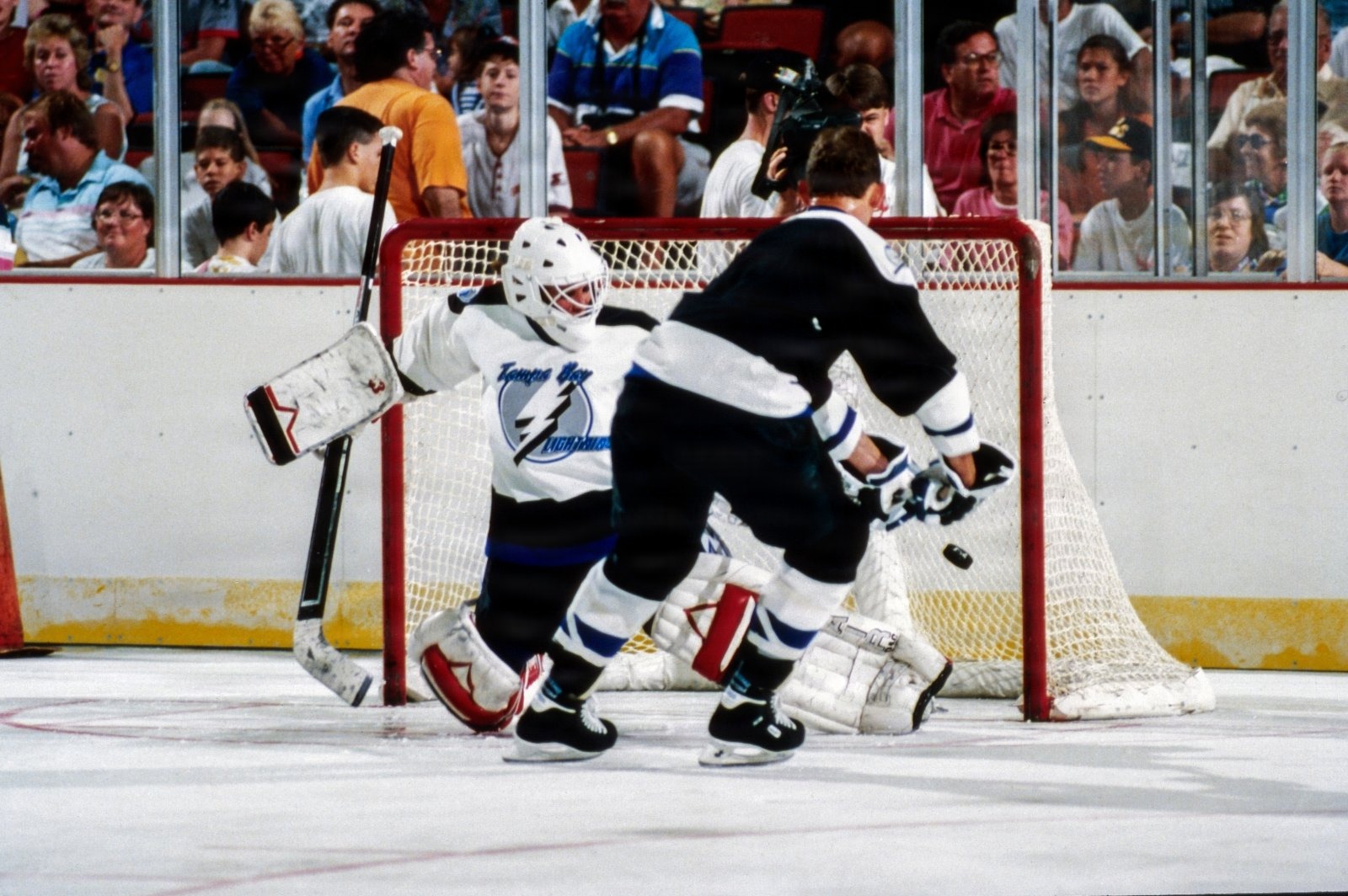 Anatoli Semenov takes at shot on goal at goalie Manon Rheaume during Hockeyfest II on August 22, 1992