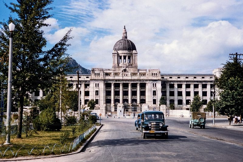 The Government-General of Chōsen Building, also known as the Japanese General Government Building and the Seoul Capitol, was a building located in Jongno District of Seoul, South Korea, from 1926 to 1996. This photo, taken c.1955 shows the "burned and gutted" derelict building after the Korean war and before a full restoration in 1962. The building was long felt to be a symbol of Japanese imperialism and was demolished in 1995-96.                               