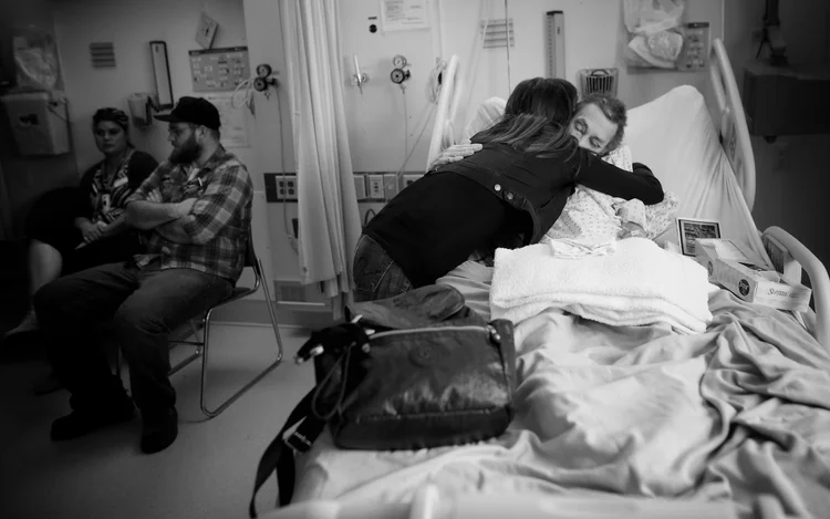 Friends give PJ McGrath a hug and say their goodbyes before he receives medical assistance in dying. &amp;nbsp;