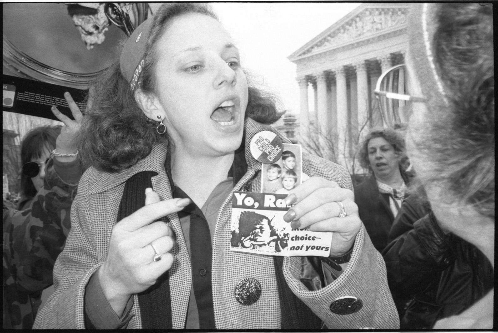 Pro-choice activist confronts Operation Rescue at the annual Right to Life March as it passes in front of the US Supreme Court building. Washington DC., January 22, 1992.