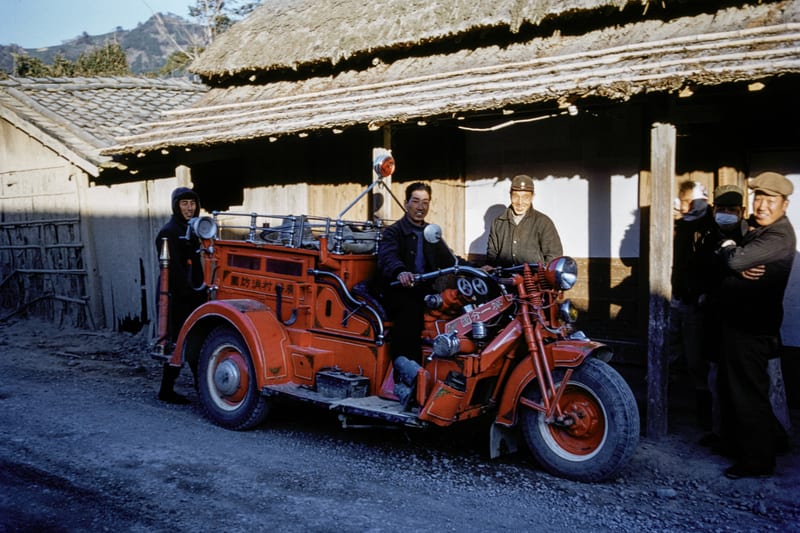 Japanese street scene showing a Pre-WW II Japanese Fire Trike possibly made by Kurogane in Japan